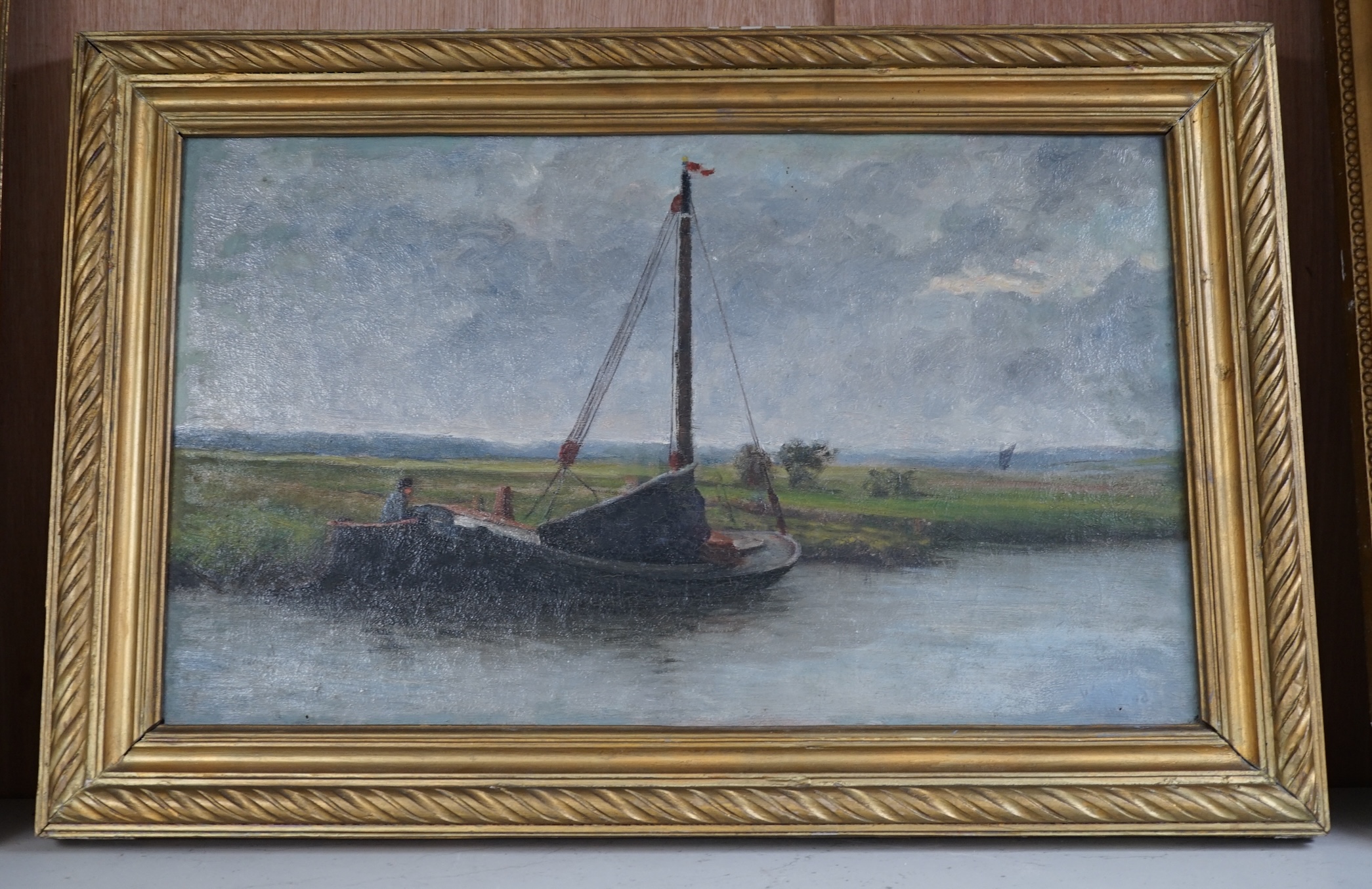 Late 19th century, Norfolk School, oil on canvas, Riverscape with barge, unsigned, 29.5 x 49cm, gilt framed. Condition - fair to good